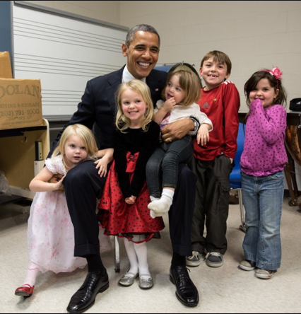 Emilie Parker standing with President Barack Obama...